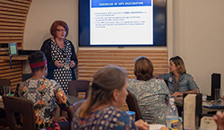 Kathleen Cartmell speaking to a group of nurses